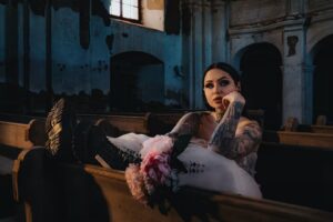 Tereza in a wedding dress in an abandoned church during an urbex shoot