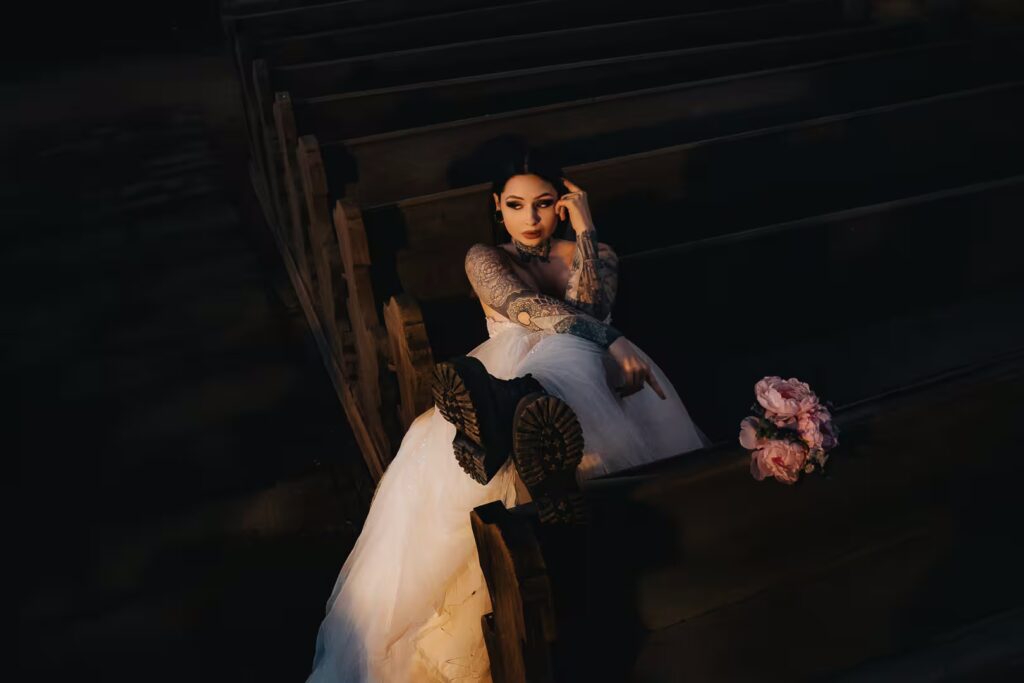 Tereza with her wedding dress draped over a church pew