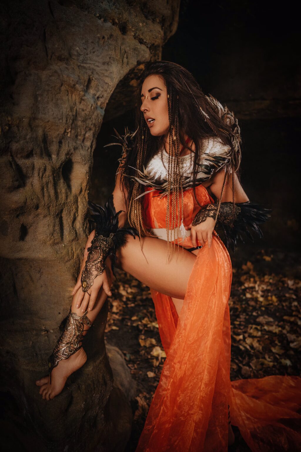 Barbora Zavadilová in an orange costume among rocks