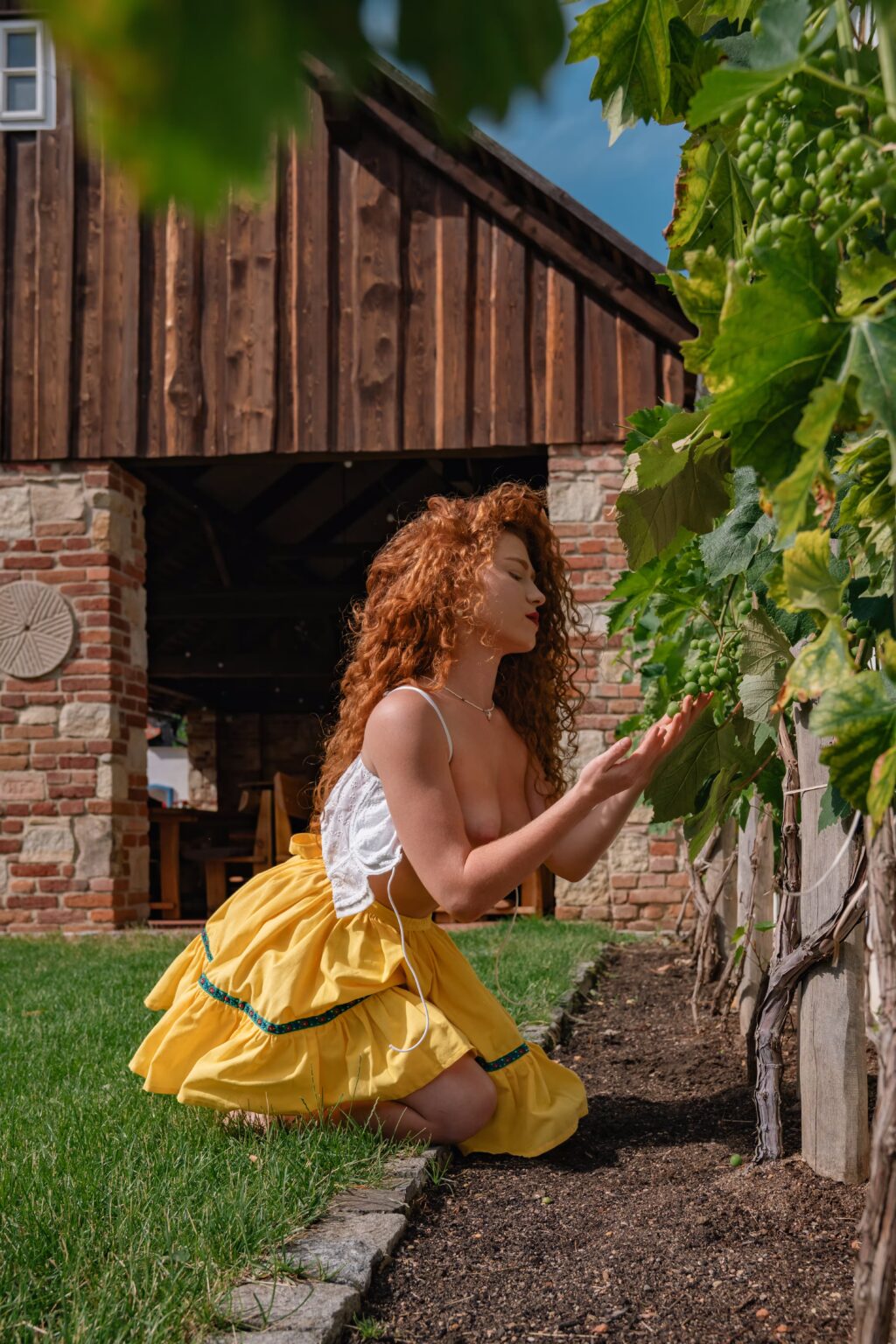 Anna Sharhorodska in a yellow dress outdoors