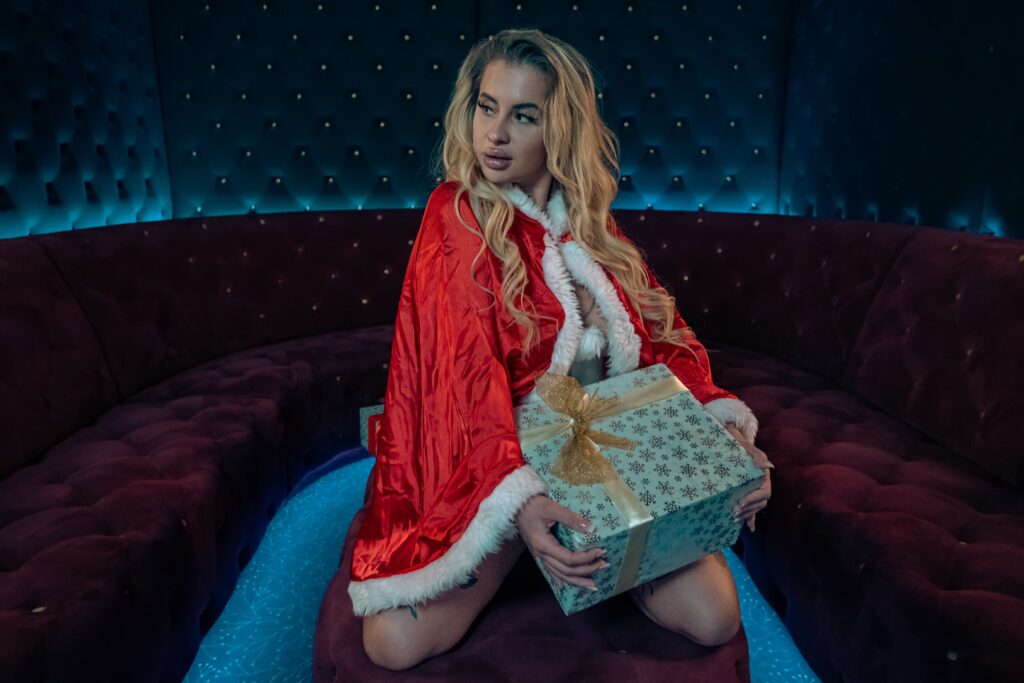 Vermora posing as Santa during a Christmas photoshoot at Goldfingers Prague