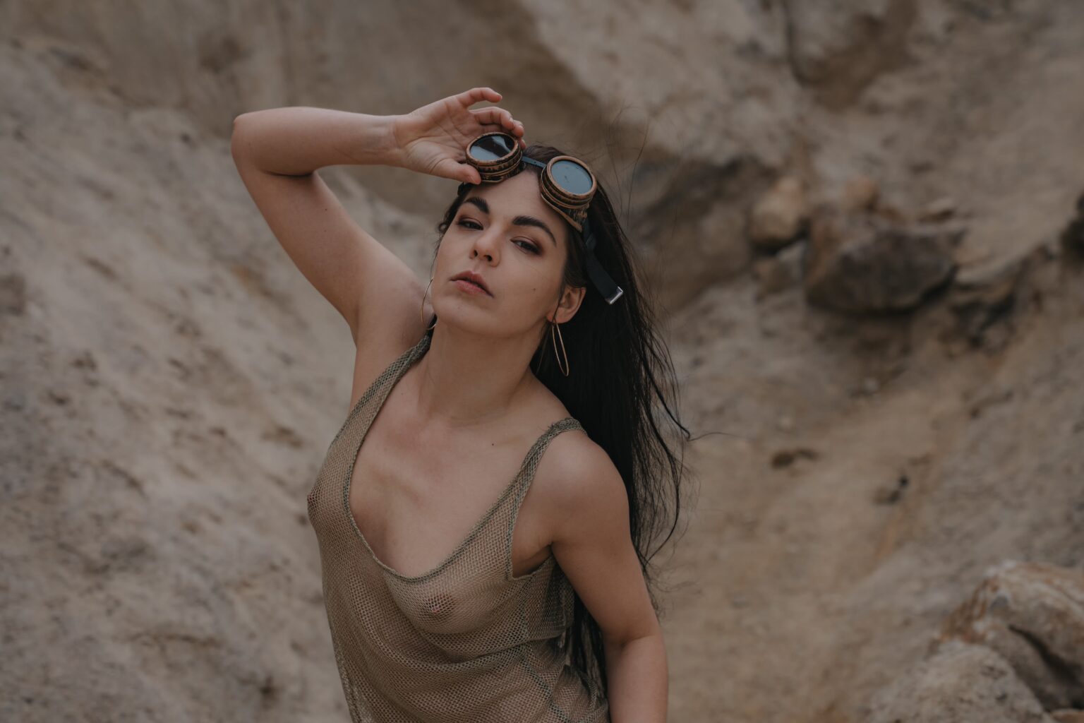 MovenModel posing in a sand quarry